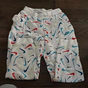 Nike White Pants with Colorful Swoosh Design